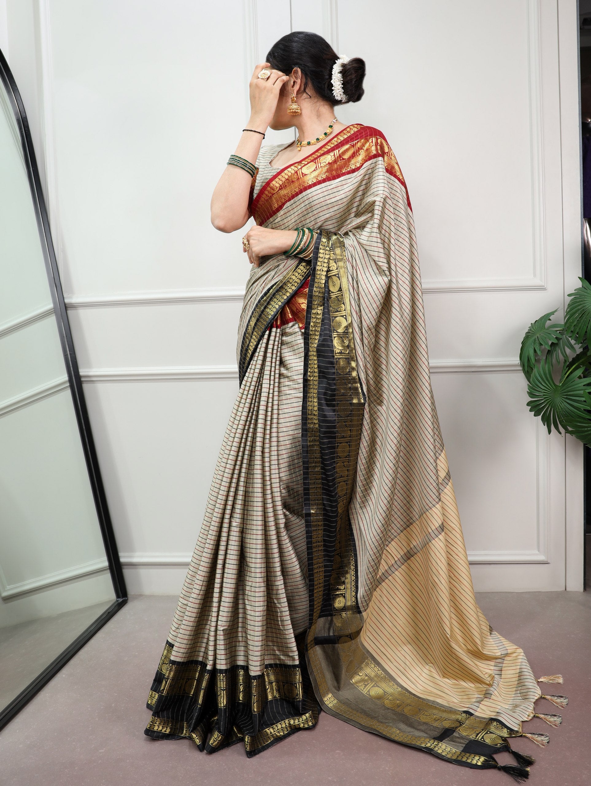 Sharvika Silk Checks Pattern Saree with Ornate Zari Border