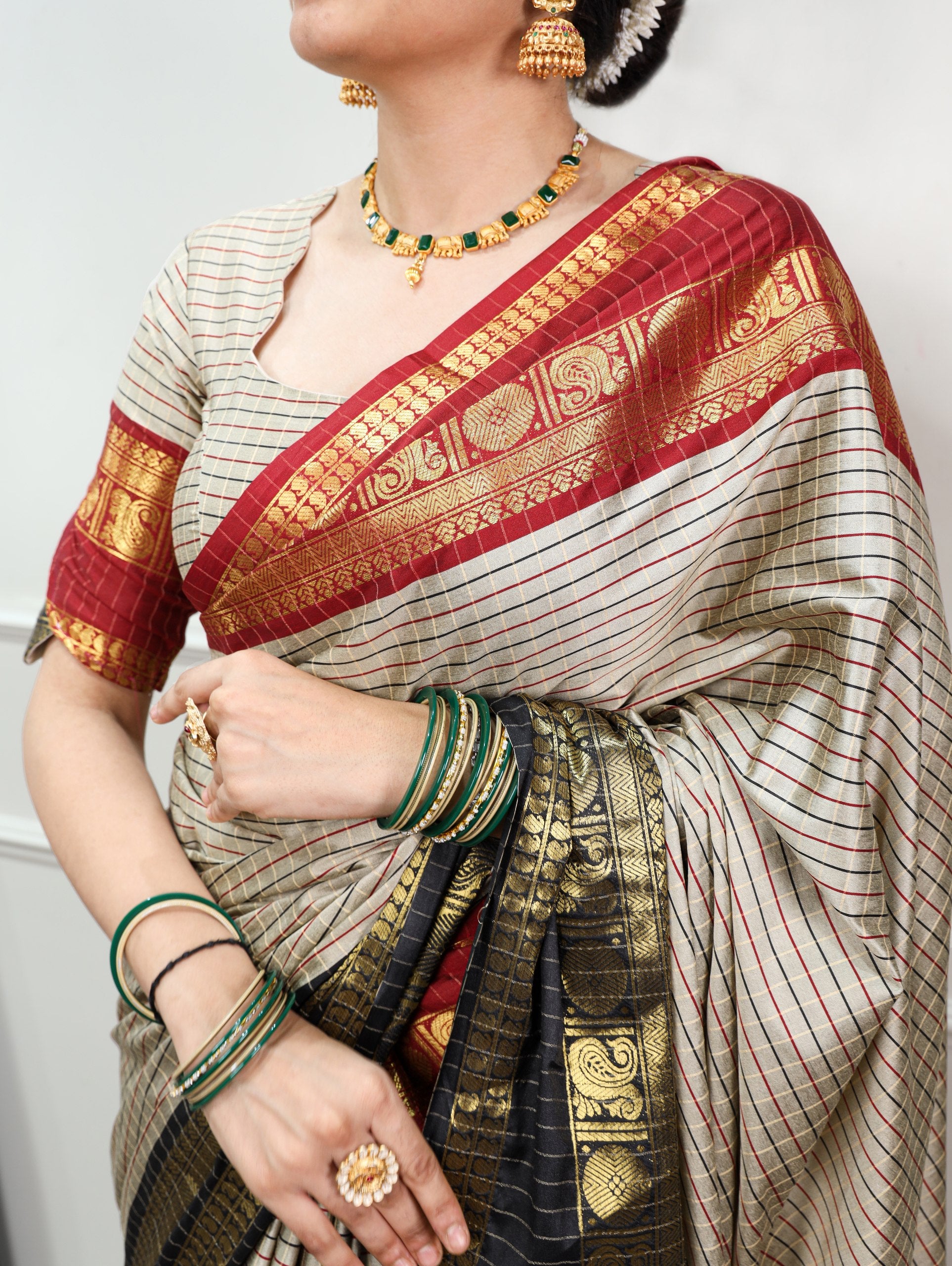 Sharvika Silk Checks Pattern Saree with Ornate Zari Border