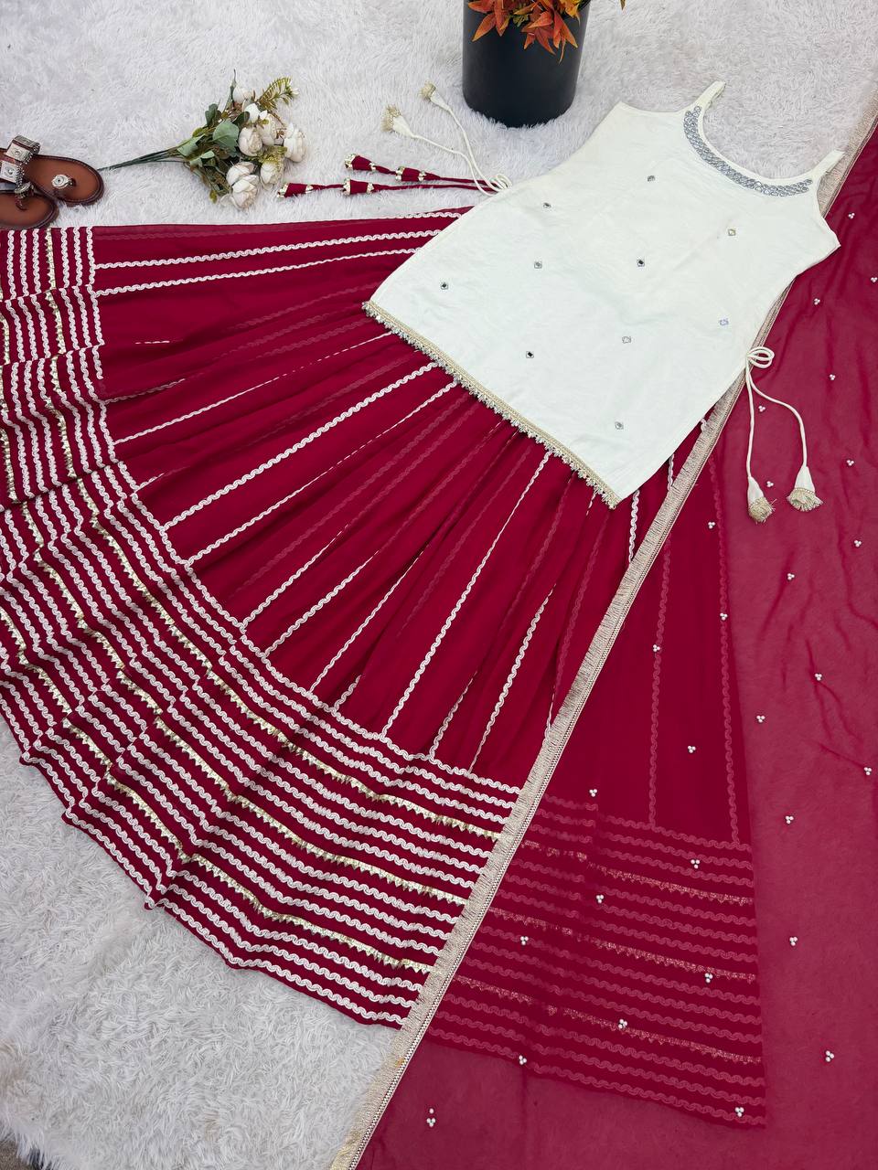 Designer Sleeveless Lehenga with Mirror Work & Embroidered Georgette Flair