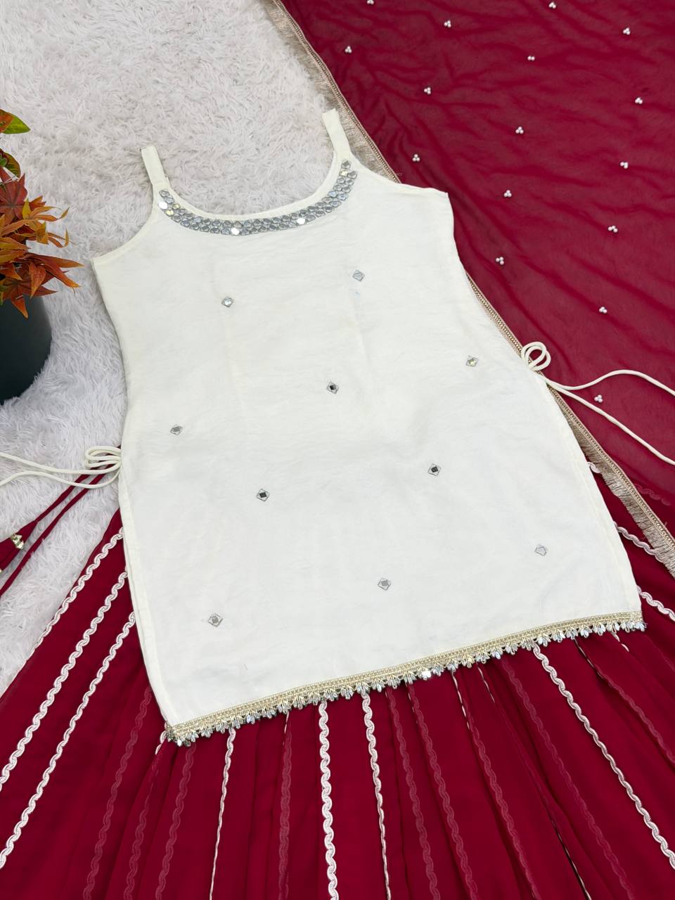Designer Sleeveless Lehenga with Mirror Work & Embroidered Georgette Flair
