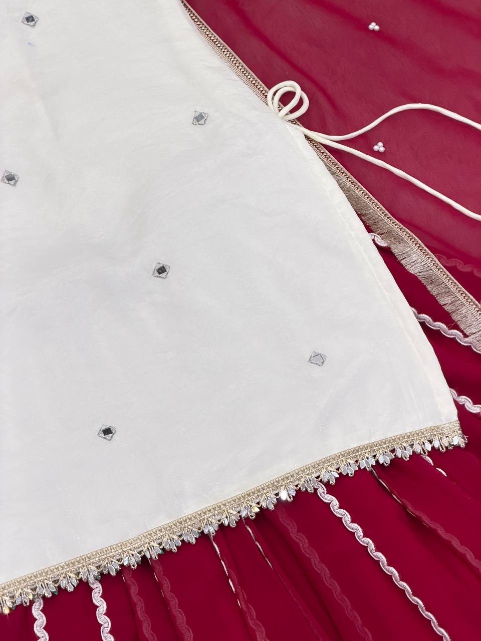 Designer Sleeveless Lehenga with Mirror Work & Embroidered Georgette Flair